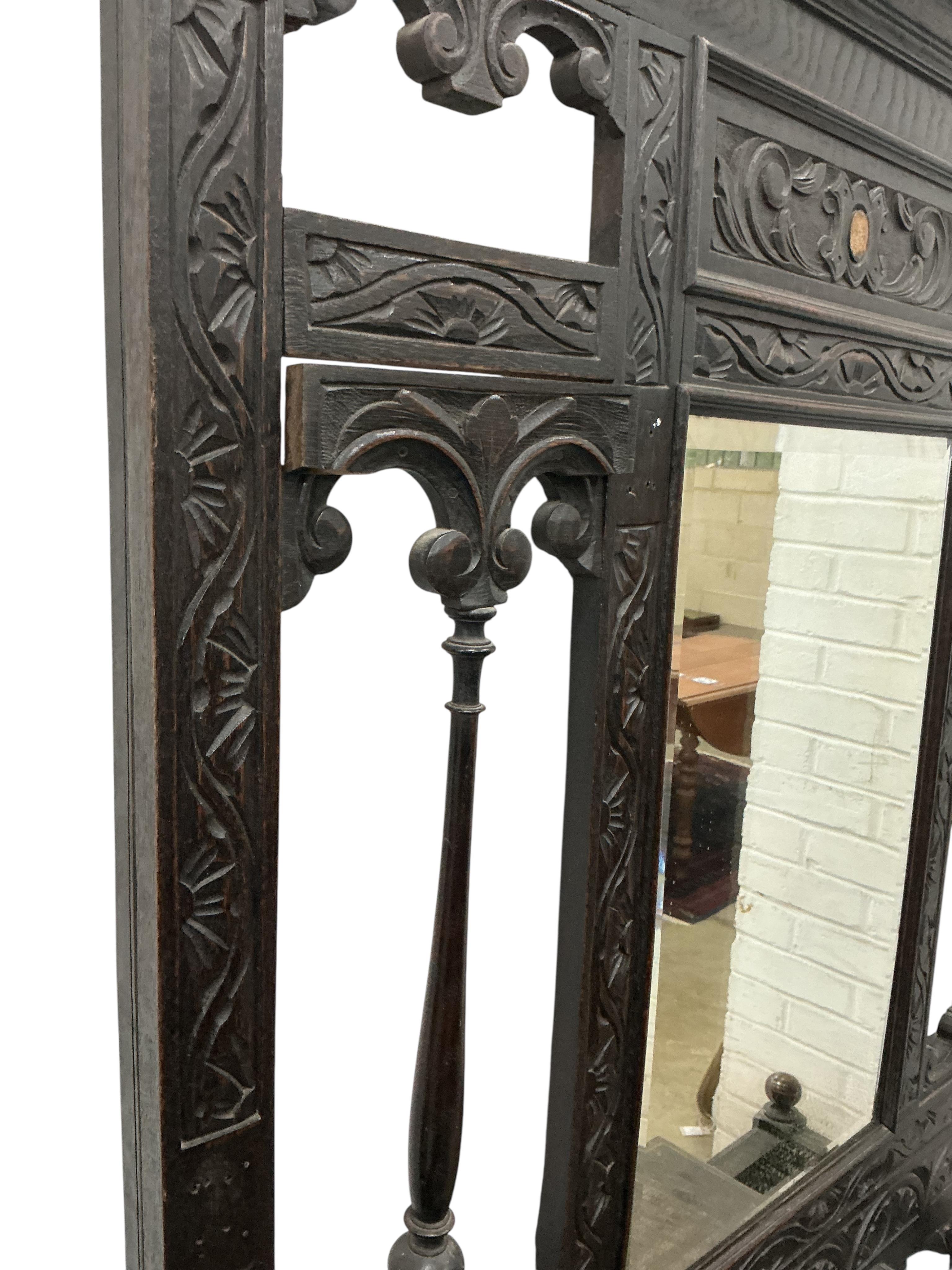 A late Victorian carved oak hallstand, width 108cm, height 210cm